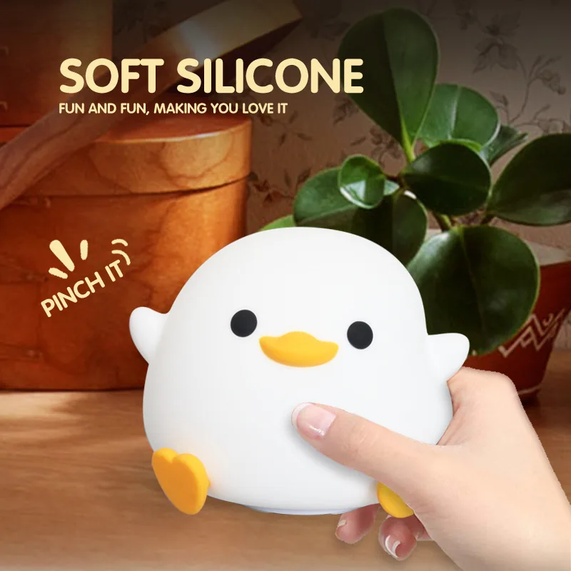 Duck shaped silicone night light glowing warm white
