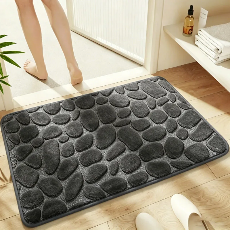 Grey flannel bath mat with an embossed pebble pattern