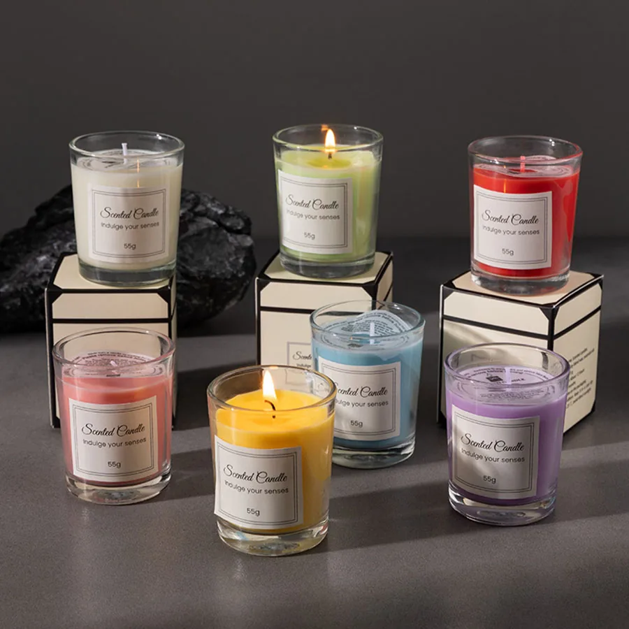 Scented candles in glass jars with their gift boxes
